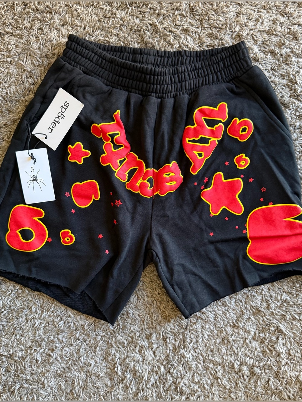 Sp5der Men's Black Athletic Shorts with Red and Yellow bubble print